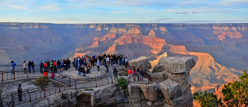 Layered red and orange cliffs of the Grand Canyon under a wide sky