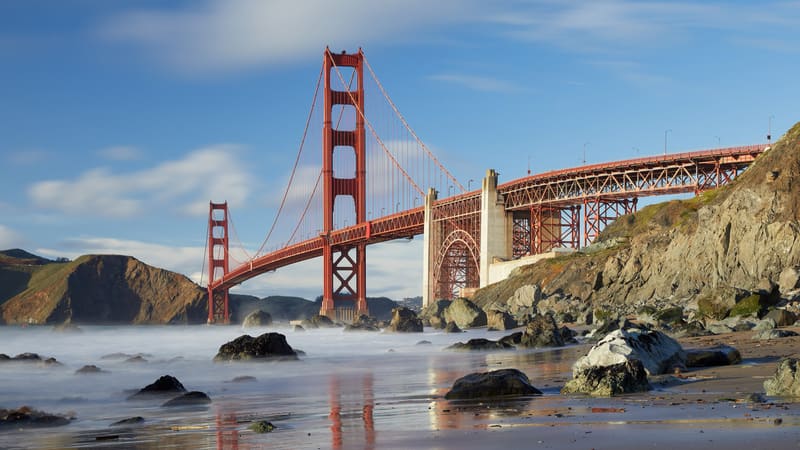 The Golden Gate Bridge in San Francisco, a red suspension bridge spanning the entrance to the bay